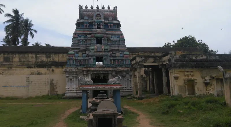 The gopuram above the temple walls with a Nandi platform before it