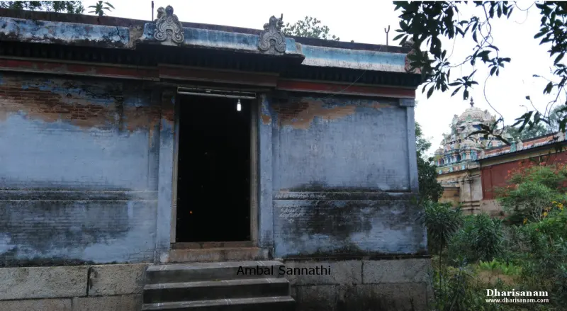 A small stone shrine with a flat roof and steps up to a dark doorway; Ambal Sannathi is written across the front.