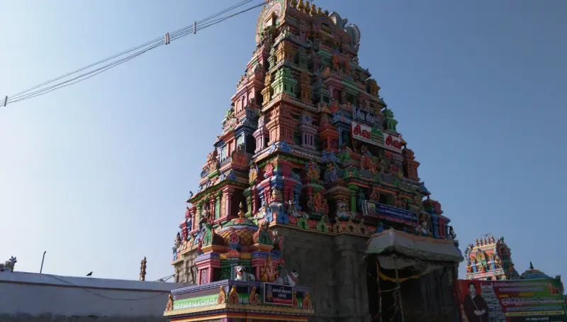 Tall colourful tower crowded with painted deity sculptures