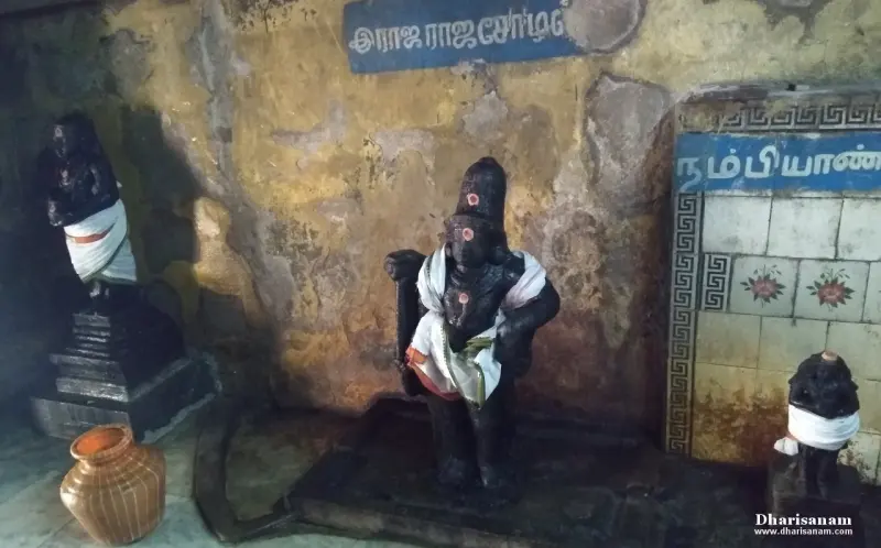 Cloth-draped idols under Tamil name boards