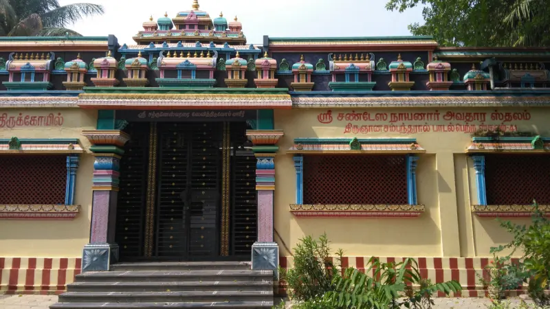 Temple facade with Tamil inscriptions, steps and a painted top