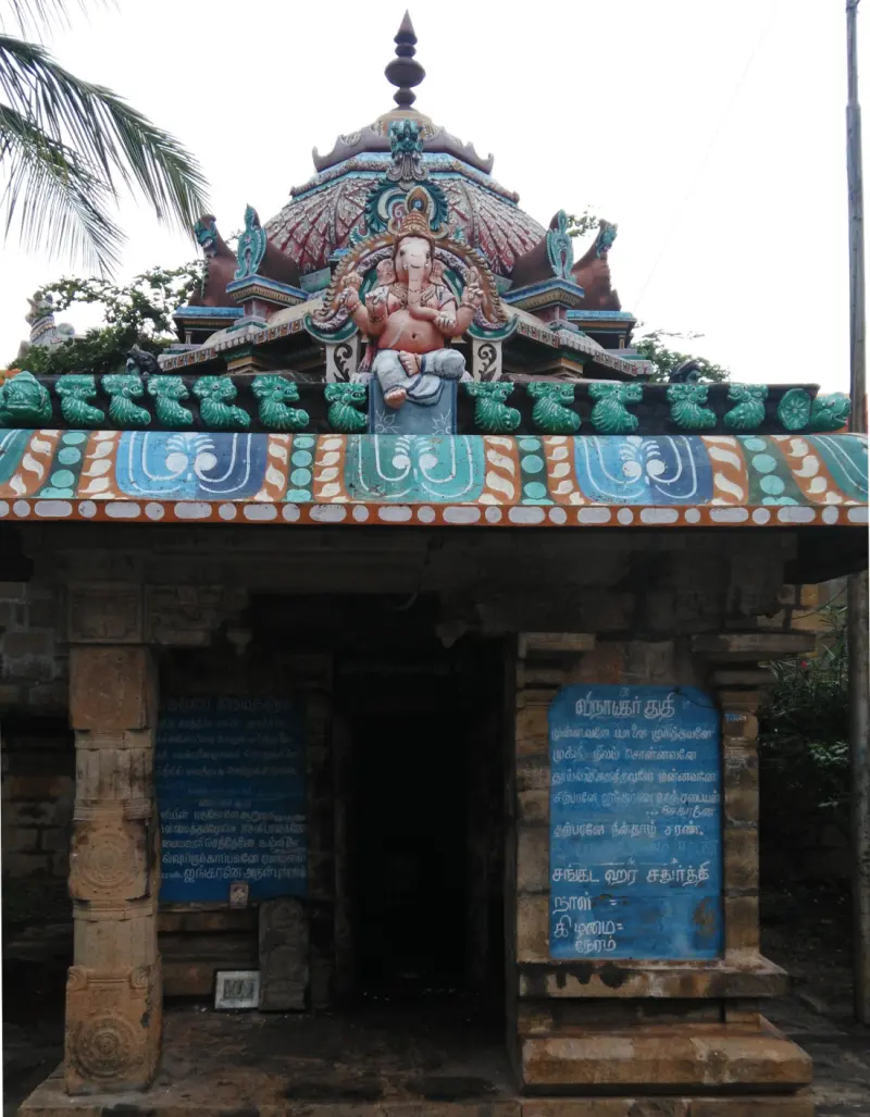 A small shrine with a Vinayakar figure on its roof