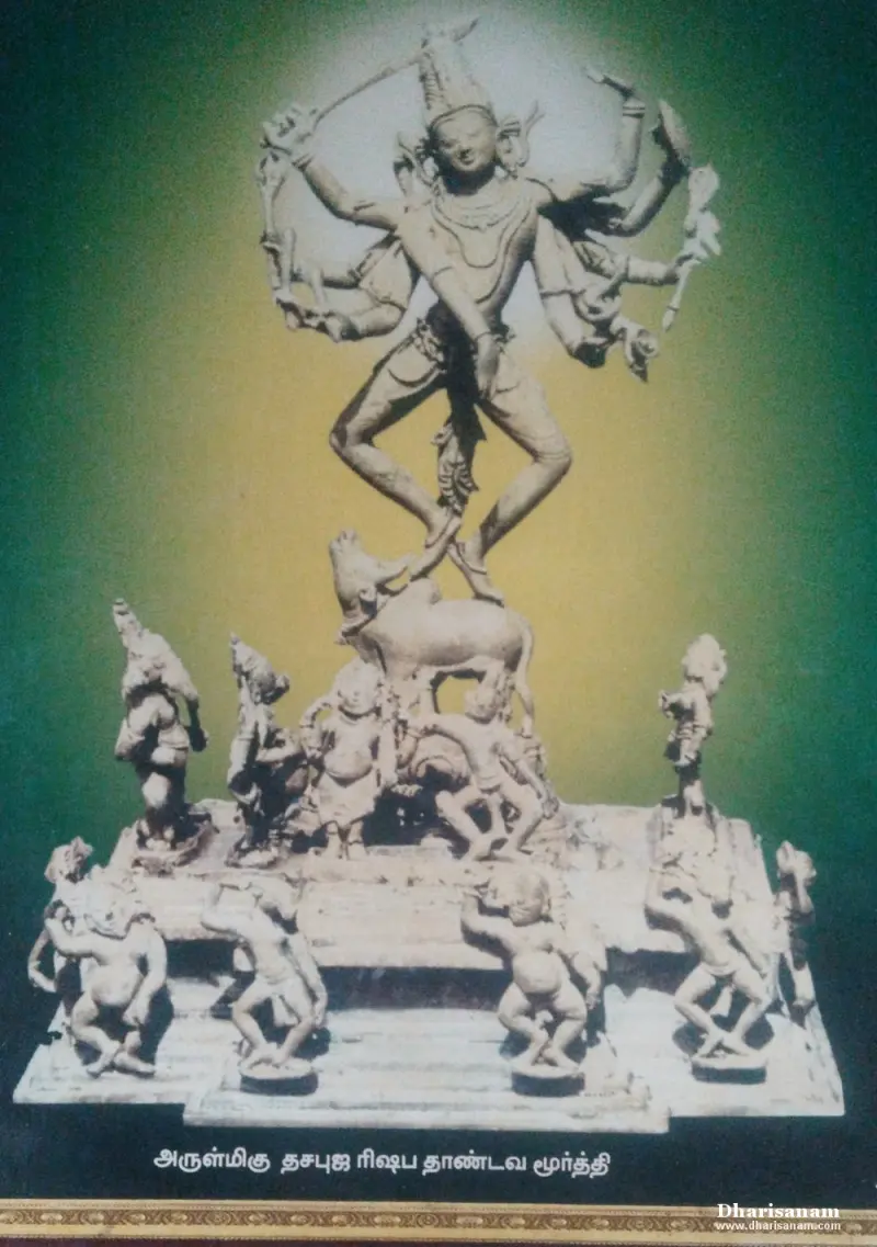 A framed picture of Shiva dancing on a bull with many arms, with attendants on the base below.