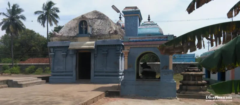 Blue domed shrine with a doorway on the left and a smaller open shrine with a Nandi to its right