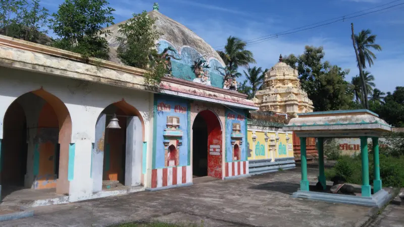 Painted shrine buildings and a vimana with a Nandi shelter