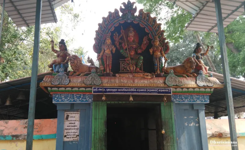 A shrine front with painted figures of a goddess flanked by two lions and a board naming Ashtabuja Mahakali