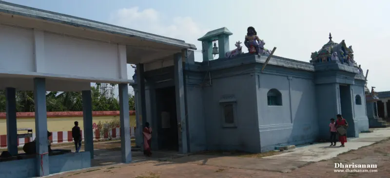 Pale blue shrine buildings with figures on the roof