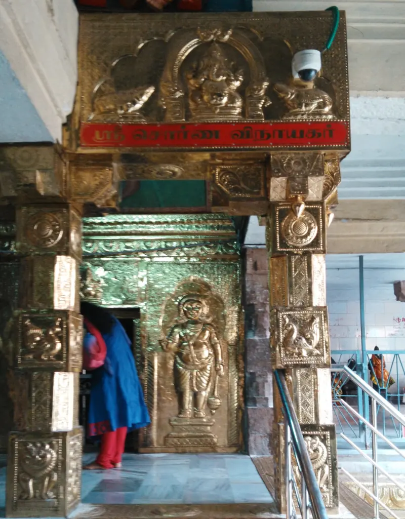 A gilded doorway leading to a shrine