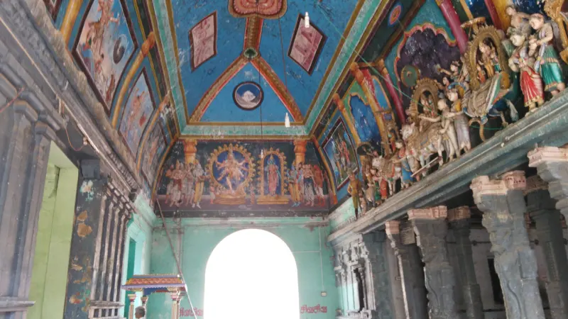 Painted ceiling and crowded deity figures in a hall