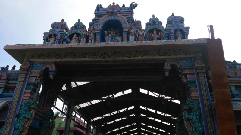 A painted entrance gateway seen from below
