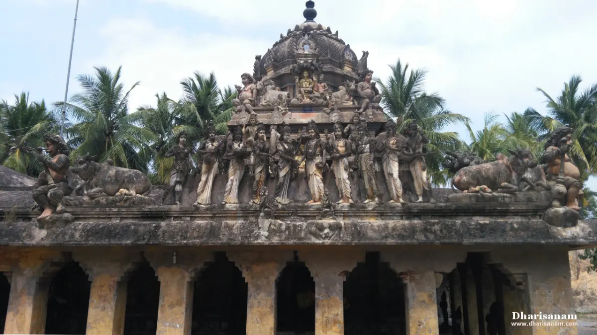 Front hall with arched openings and rows of sculpted figures above its roof