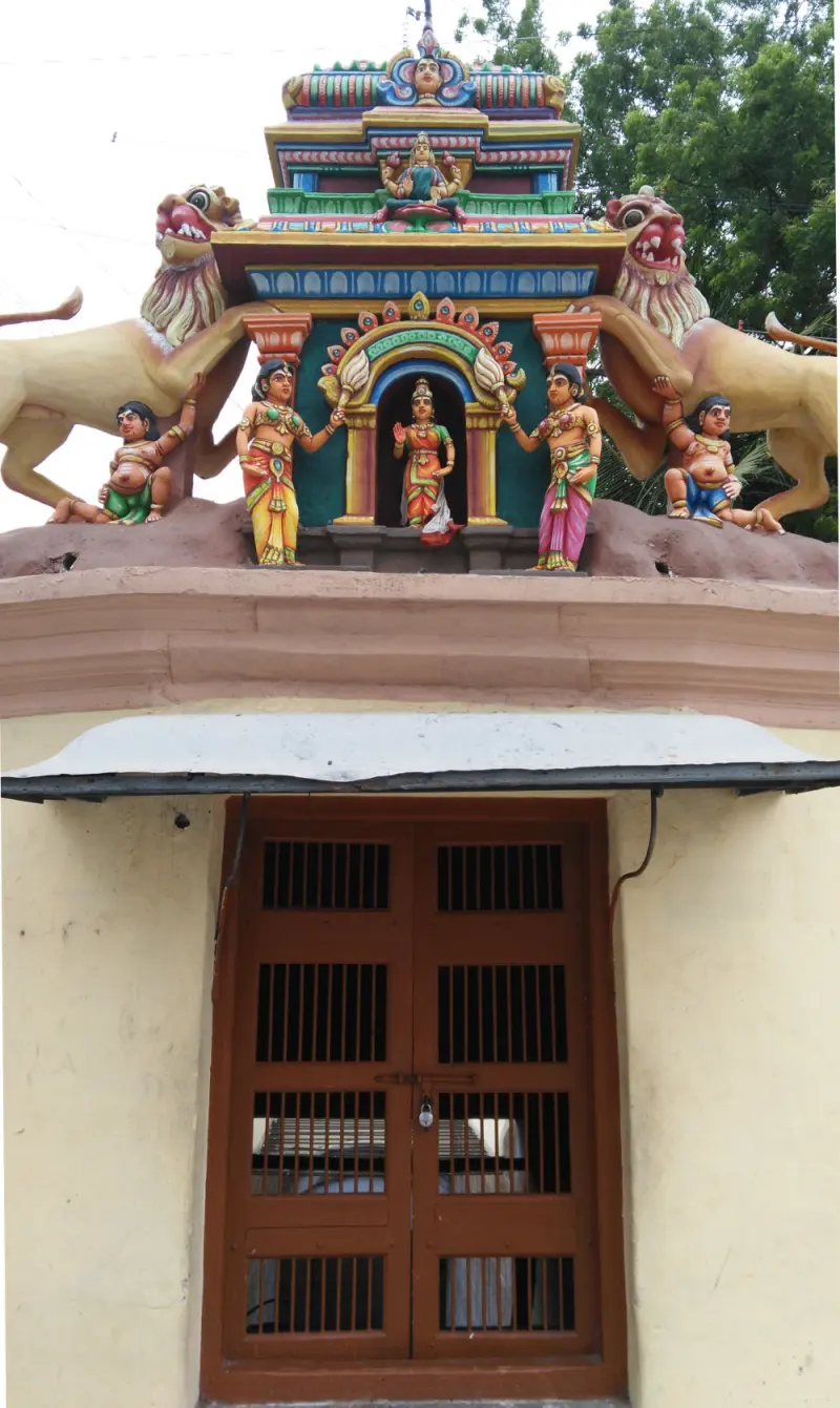 Small tower with goddess, lions and figures over a locked door
