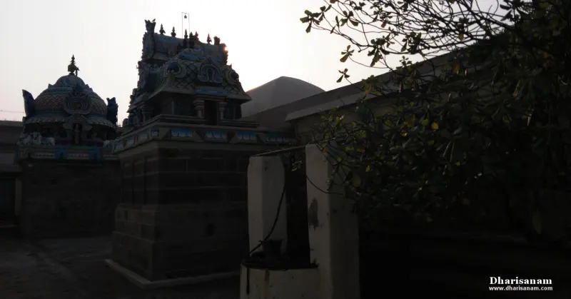 Dark silhouettes of shrine towers against the evening sky