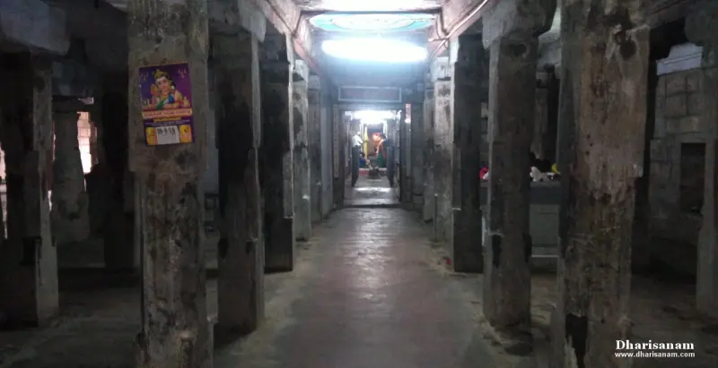 Long corridor lined with tall stone pillars