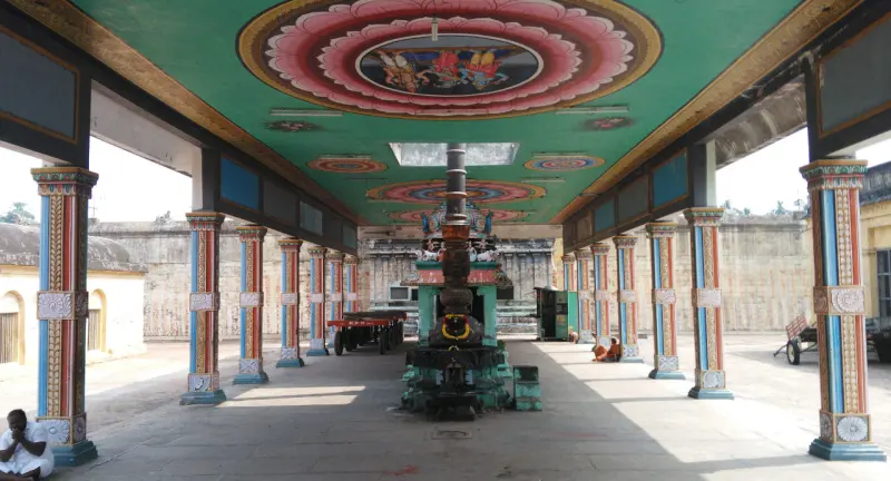 Open hall of striped pillars under lotus medallions