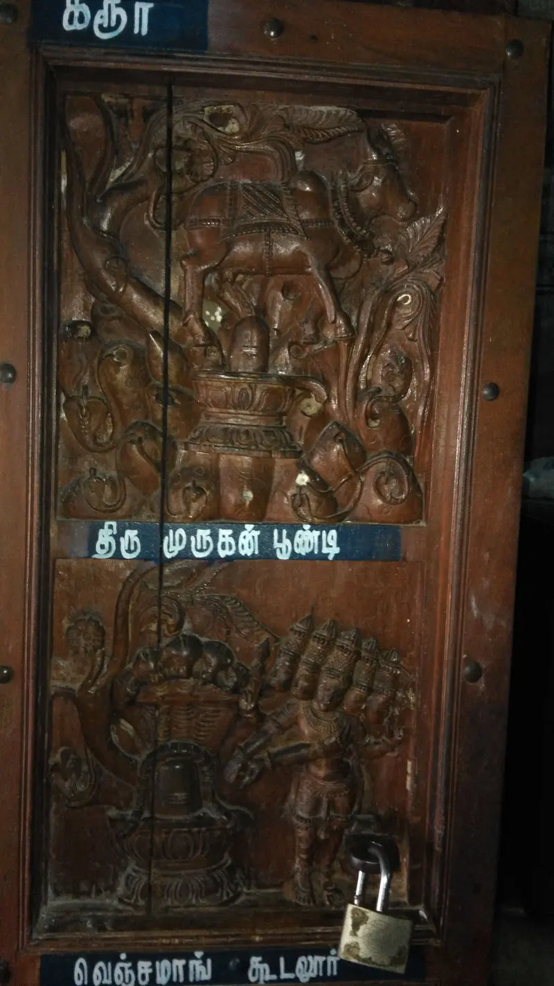 Carved figures on the doors of the sanctum sanctorum