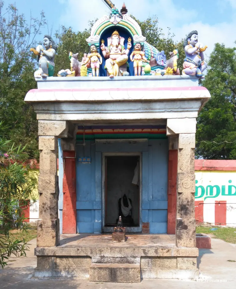 A small shrine with colourful Vinayakar figures on its roof