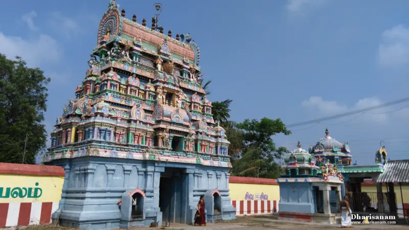 The tall tower and a smaller shrine with people before them