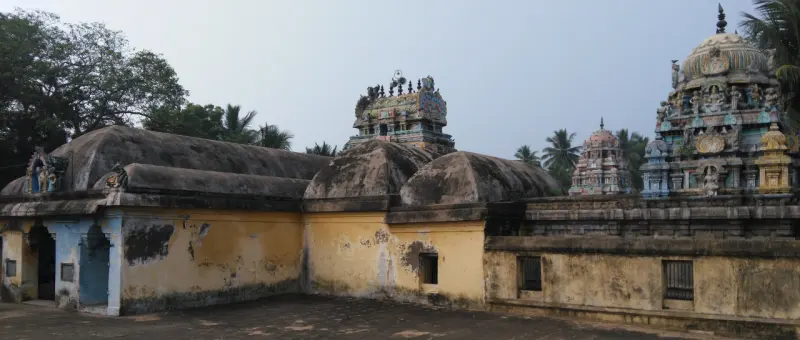 Corridor roofs and towers seen across the courtyard