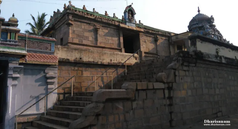 Wide stone steps with rails leading up to the raised shrine