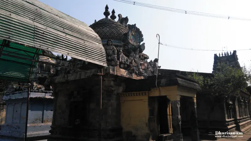An old stone tower crowded with figures