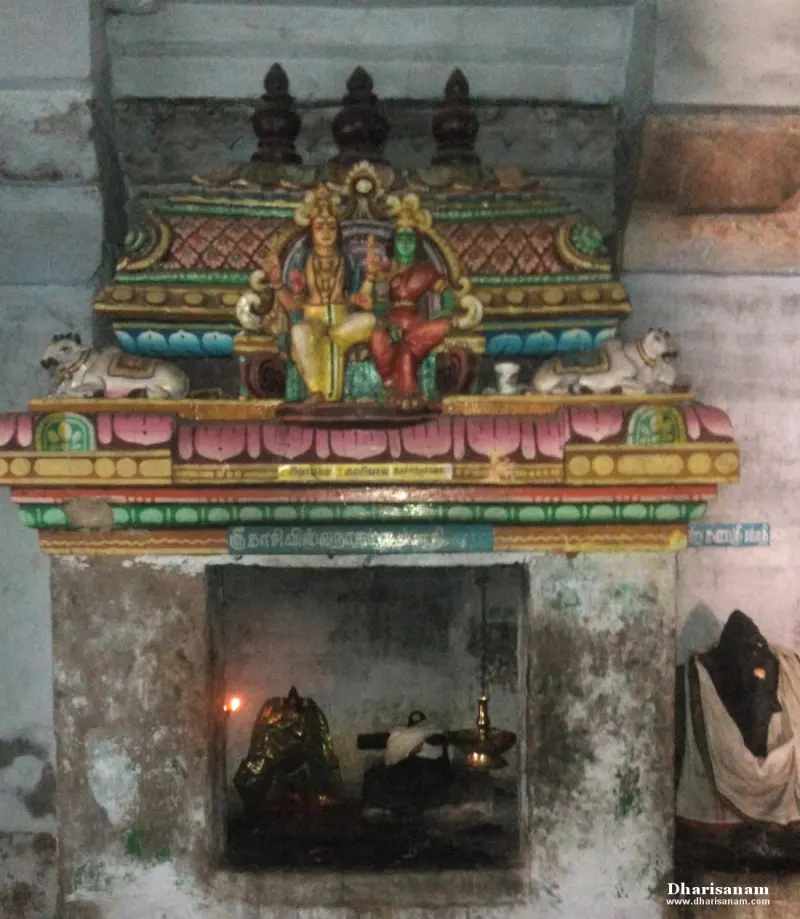 Niche with a painted stucco Shiva and Parvathy above and two bulls at its sides