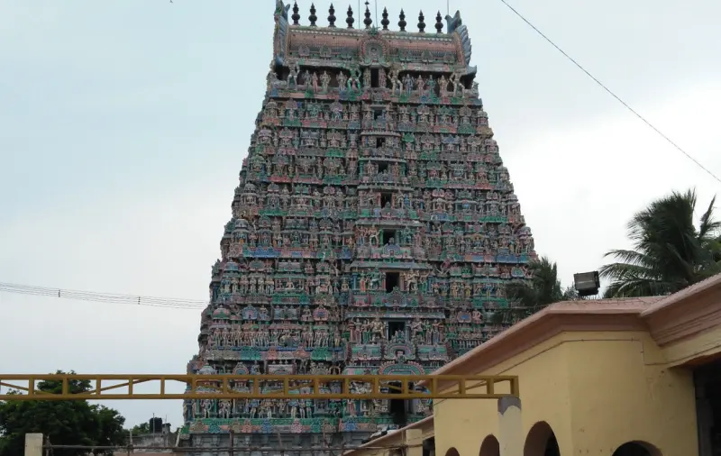 Tall colourful tower crowded with stucco figures