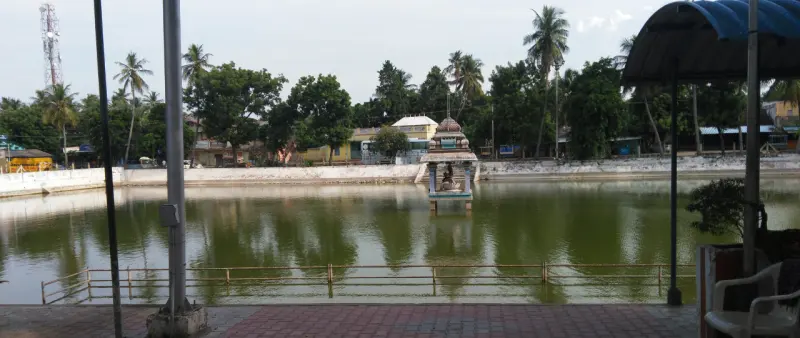 The temple tank with a small shrine in the water