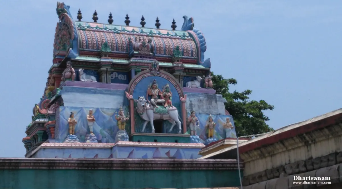 Colourful tower sculptures with Shiva on Nandi under a blue sky