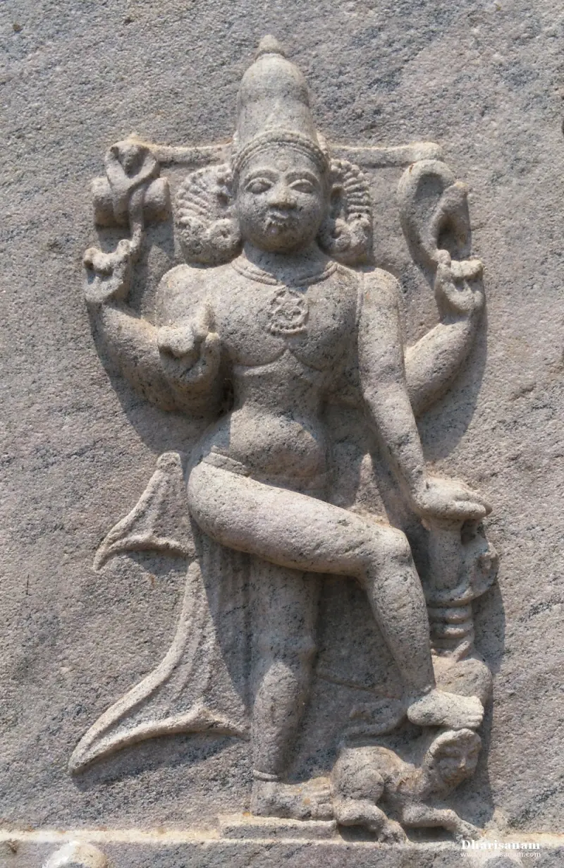 Granite relief of a standing four-armed figure with a raised leg resting on a small creature