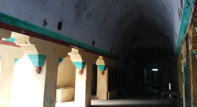 A pillared corridor under a vaulted ceiling