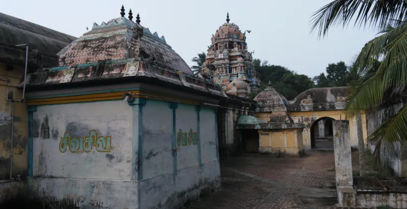 A shrine with a domed roof beside the courtyard passage