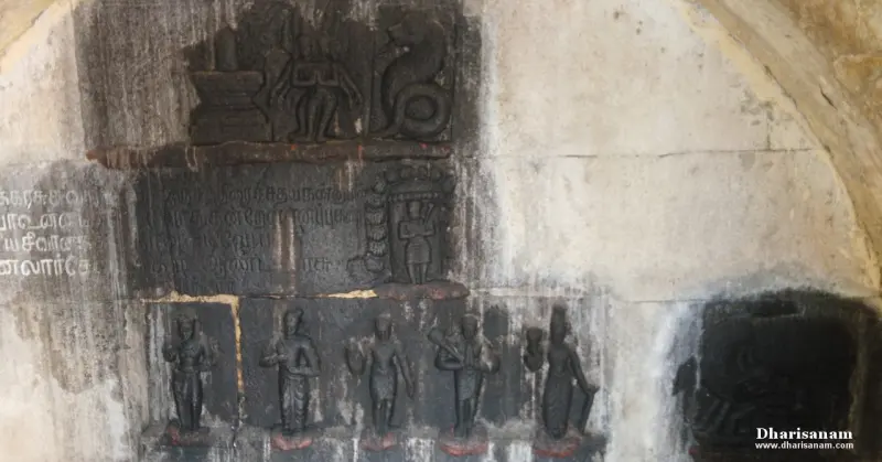 Stone reliefs on a wall: a lingam scene above, a worn inscription, and five standing figures below