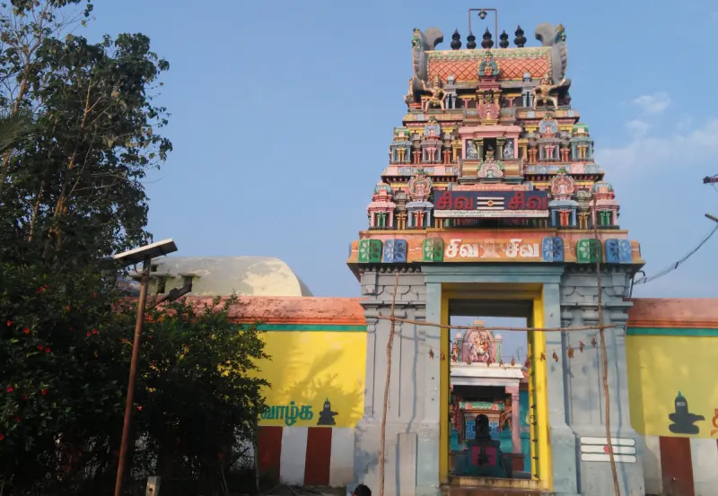 A three-tier painted tower above the temple gateway
