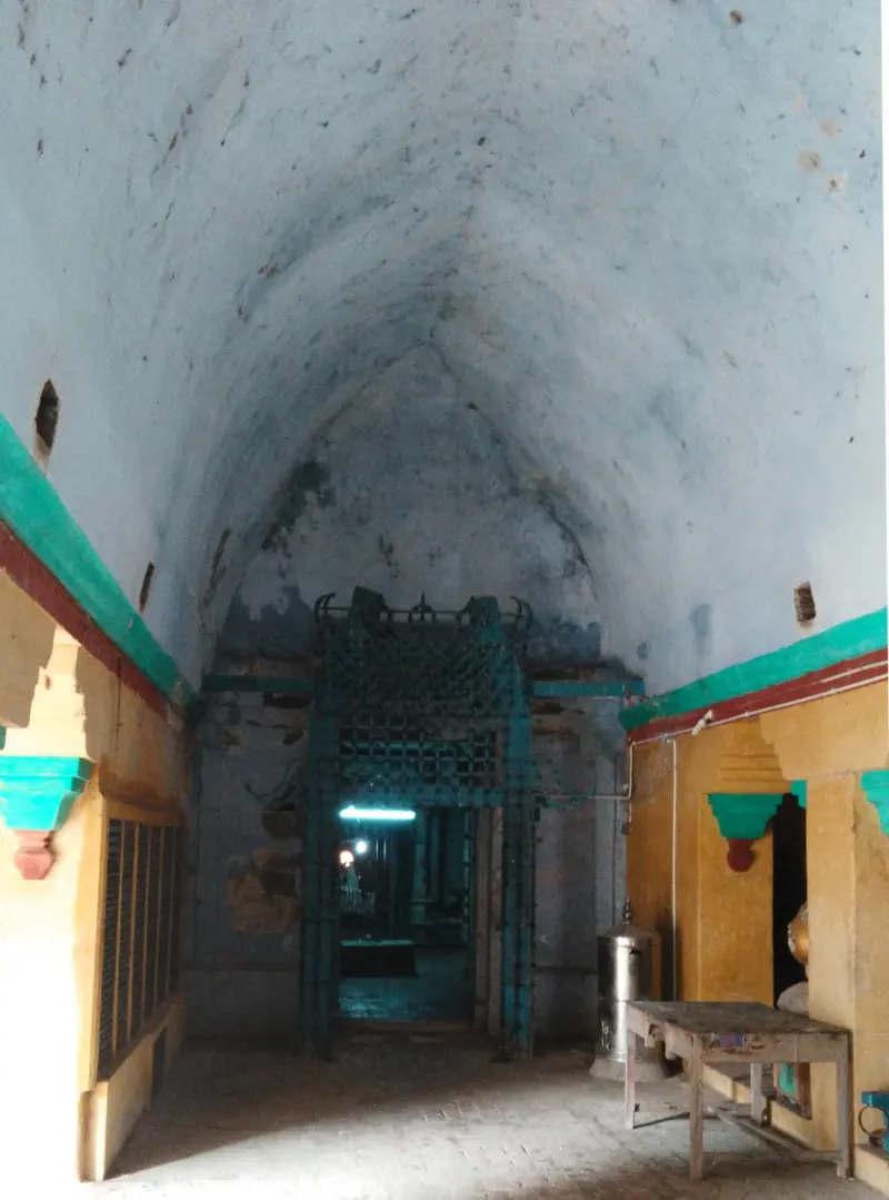 A vaulted corridor leading towards an inner doorway