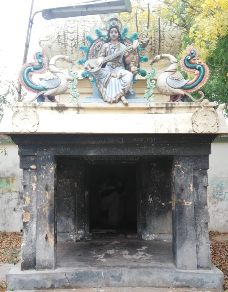 A shrine topped by Saraswathy playing the veena between two swans