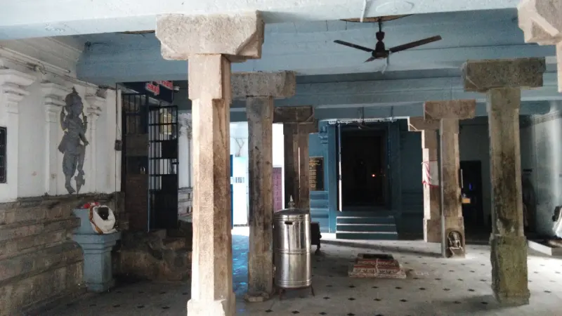 Stone-pillared hall with a shrine entrance at the far end
