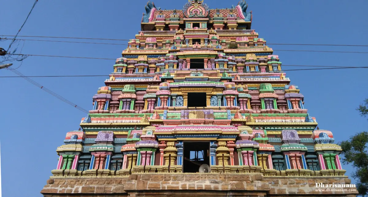 Colourful tiered gopuram against a blue sky