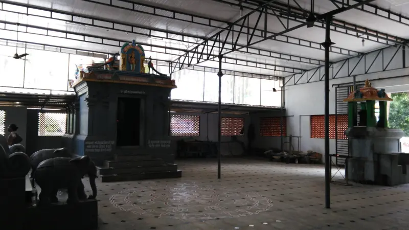 Large roofed hall with a small shrine and stone elephants
