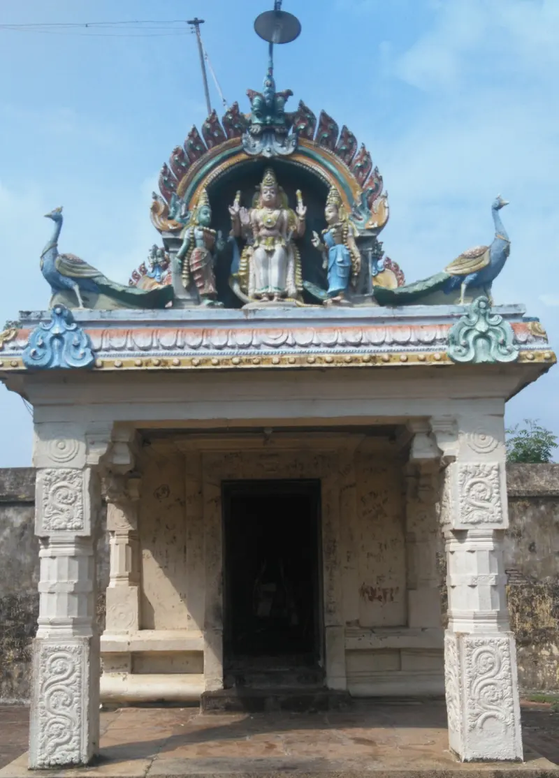 A small shrine with Murugan and his consorts above the roof, flanked by two peacocks