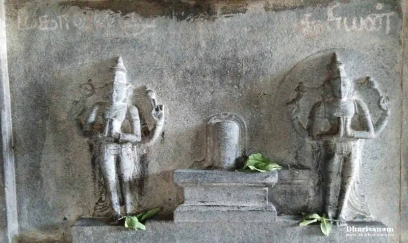 Stone relief of a lingam on a pedestal with a standing figure on each side