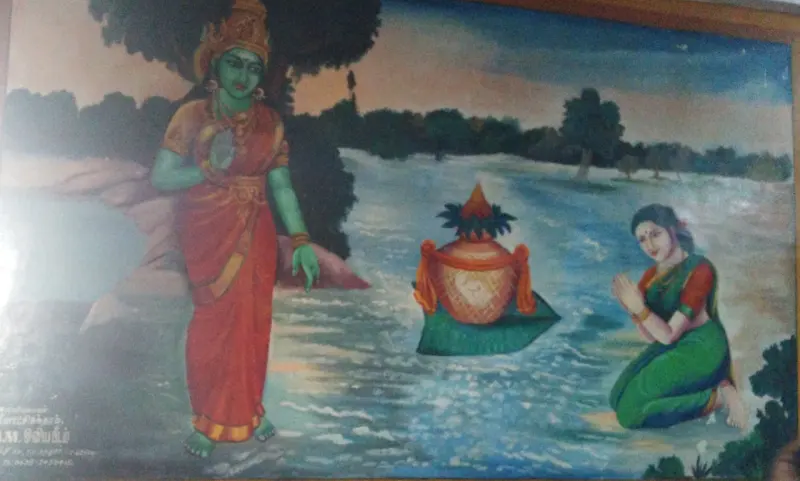 Painting: a green-skinned goddess stands by water where a sacred pot floats and a woman prays