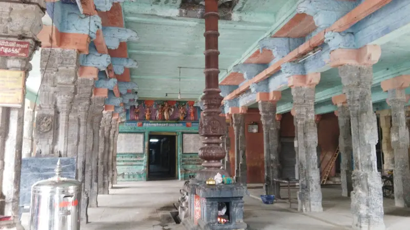 Bronze pillar on a shrine base between rows of stone columns