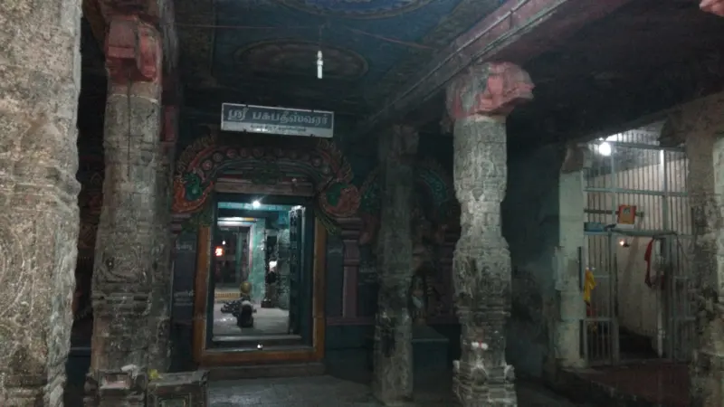 Stone doorway with a name board opening to the sanctum