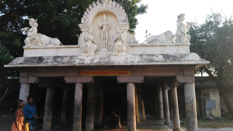 A pillared hall crowned with a goddess between two lions