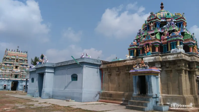 Two shrines with colourful towers under a blue sky