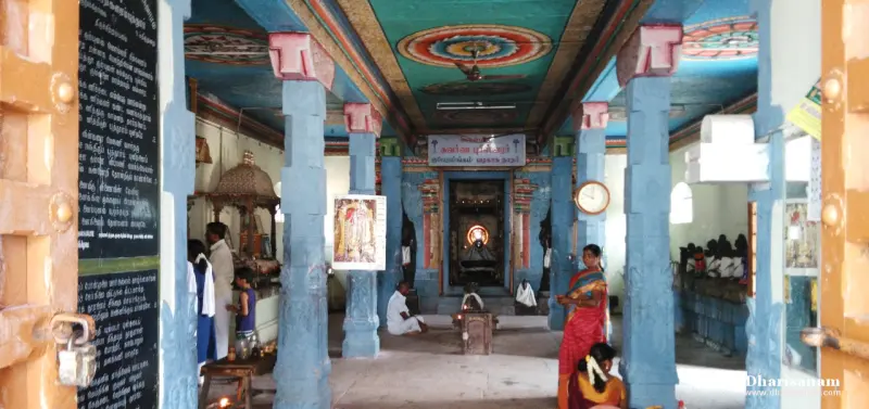 Blue pillars and a painted ceiling with people inside