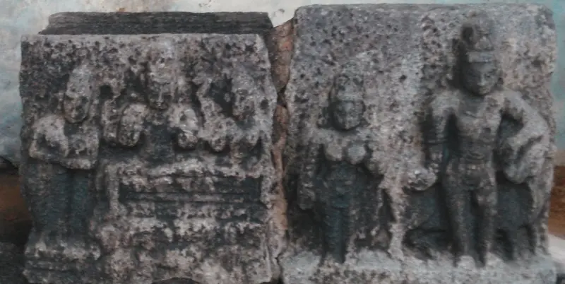 Two weathered slabs carved with standing deities and figures