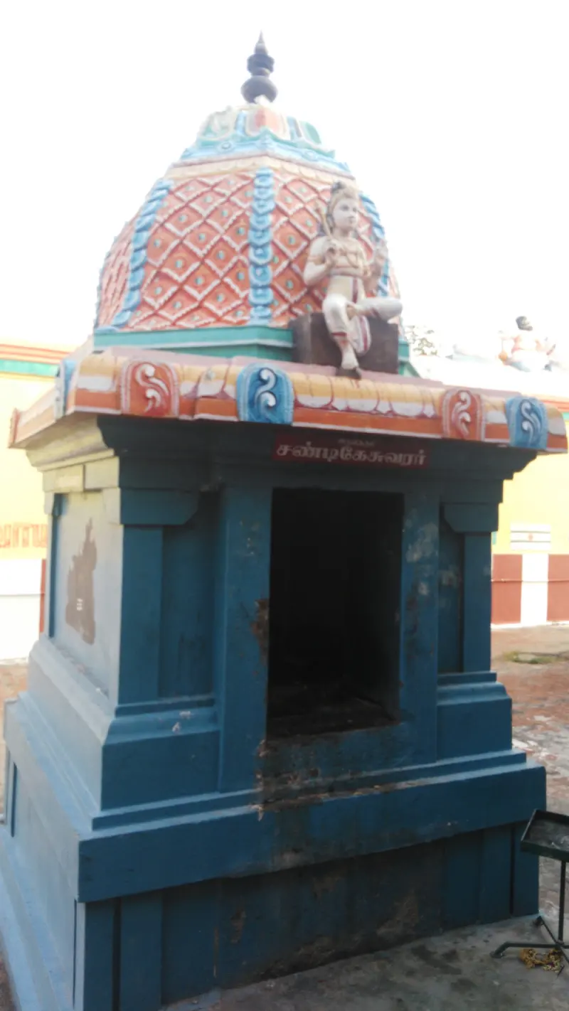 A blue domed shrine with Chandikeswarar name board