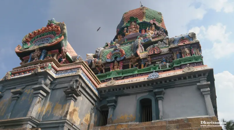 A domed roof decorated with painted figures above a plain grey wall, seen from below